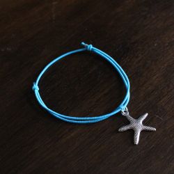 Bracelet ELII, étoile de mer et fil élastique bleu